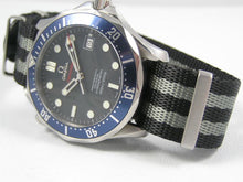 Load image into Gallery viewer, Black and Grey Spectre Premium Seatbelt Herringbone NATO® strap for Omega Seamaster
